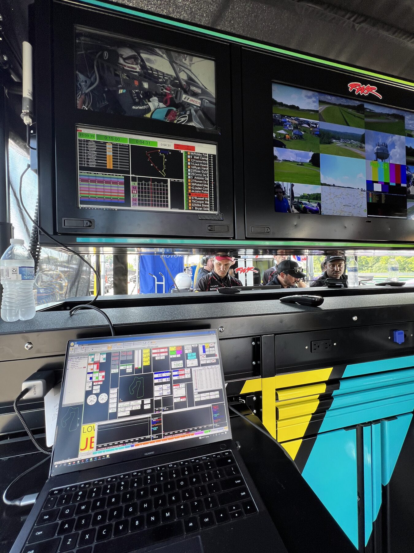 Strategy stand with live timing and telemetry monitors