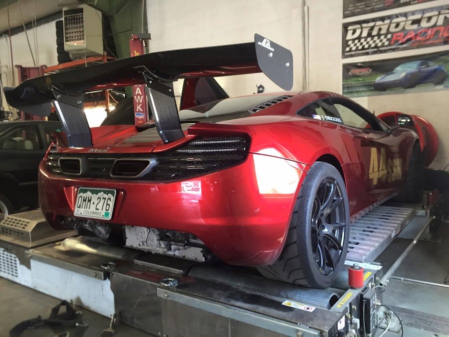 Red McLaren 12C strapped to a chassis dyno