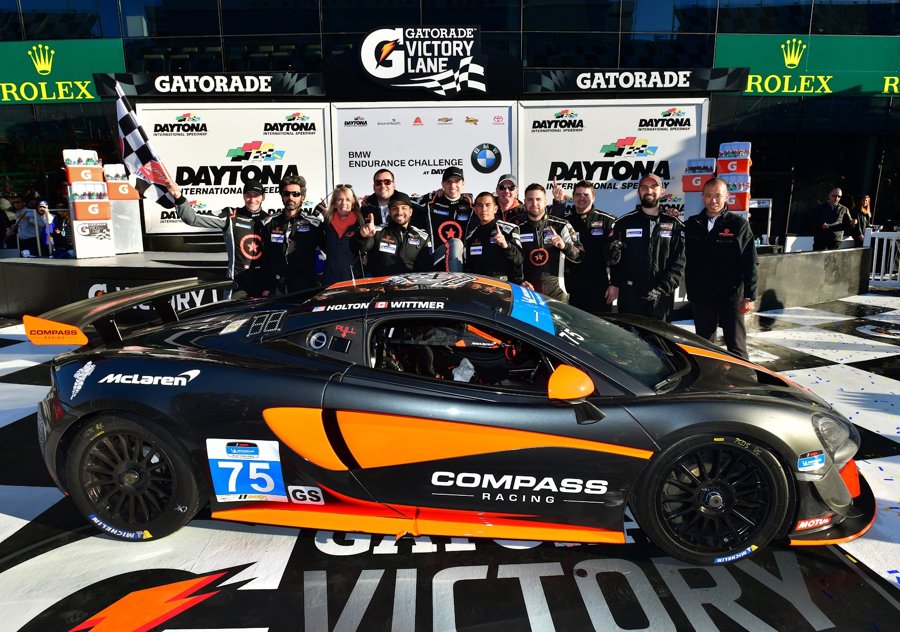 McLaren 570S GT4 number 75 with the team gathered in victory lane at Daytona