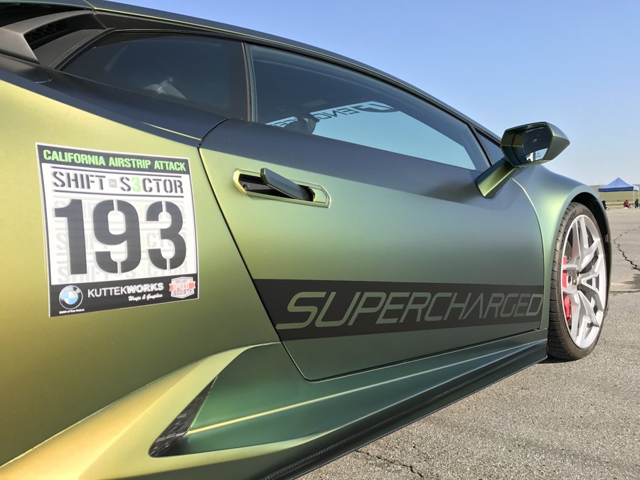 Green Lamborghini Huracan number 193 staged at an airstrip attack event