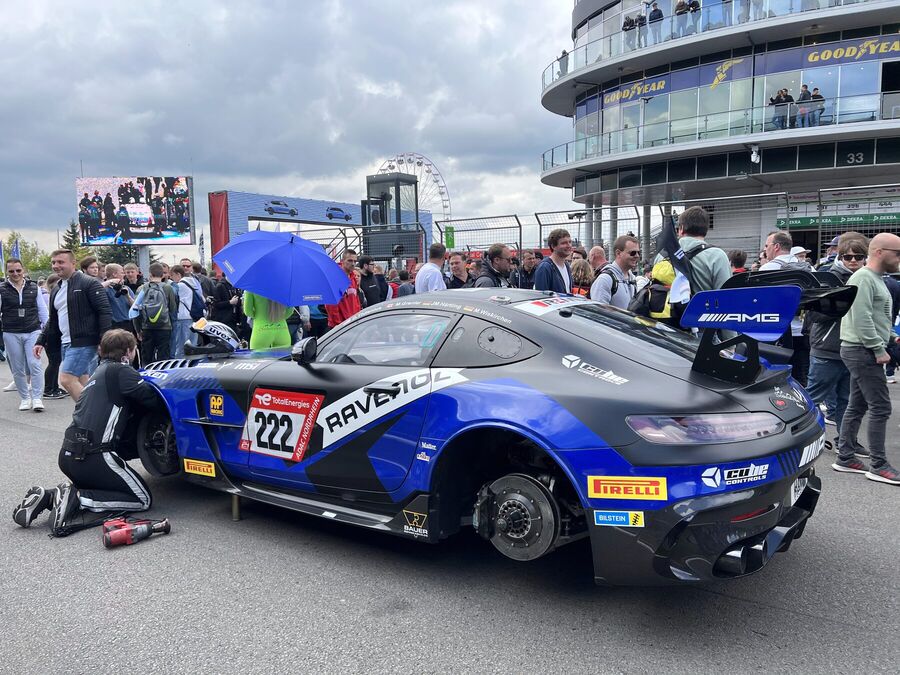 Blue GT3 car on the grid with the crew making final checks