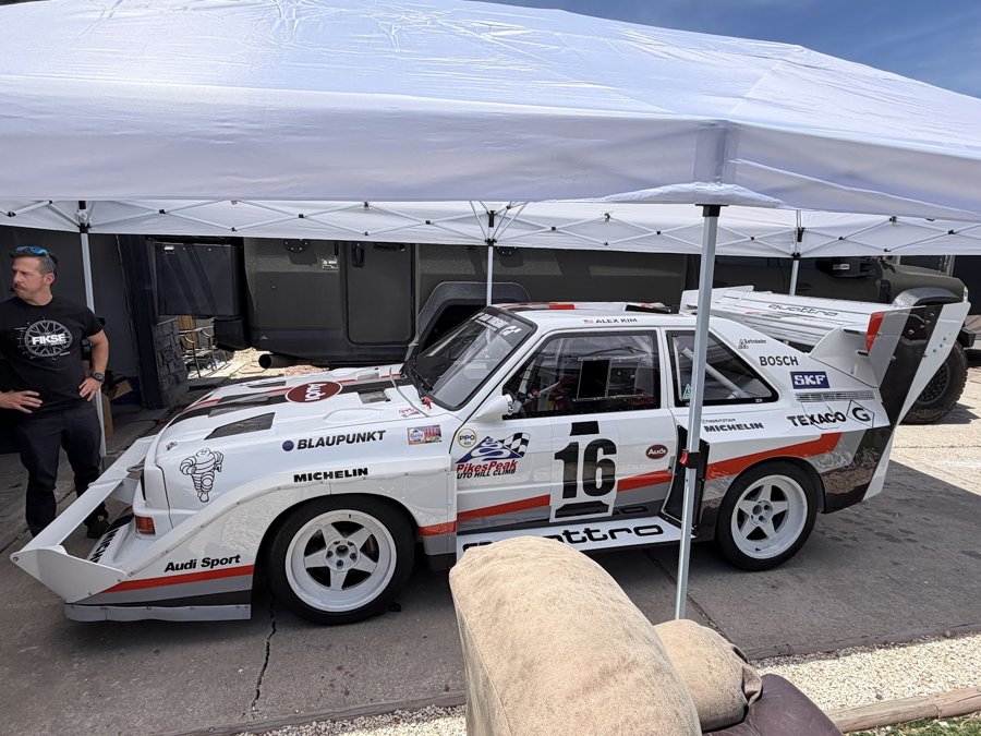 White Audi Sport quattro number 16 with hillclimb aero parked under a canopy