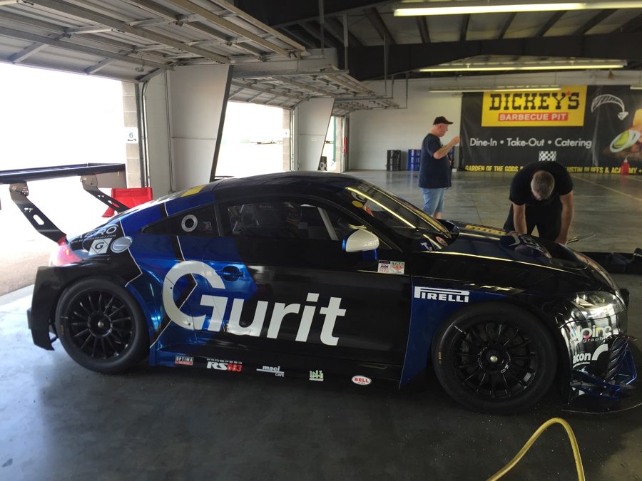 Blue Audi R8 LMS being worked on in the garage
